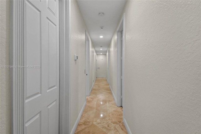 2445 Provence Cir, Weston, FL 33327 - corridor featuring baseboards, marble finish floor, a textured wall, and recessed lighting