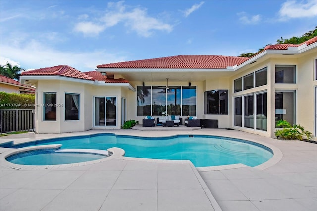 view of pool with an outdoor hangout area, a patio, and an in ground hot tub