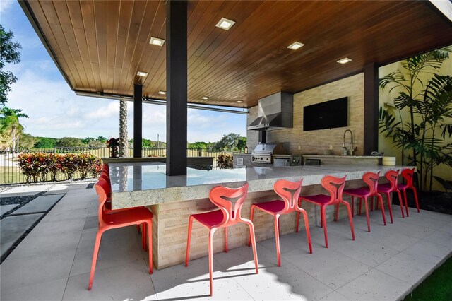 2445 Provence Cir, Weston, FL 33327 - view of patio / terrace with exterior kitchen, a grill, fence, and outdoor wet bar