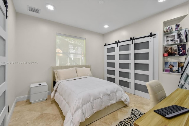 bedroom with a barn door