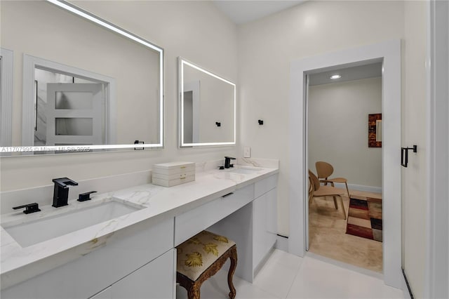 bathroom featuring tile patterned flooring and vanity