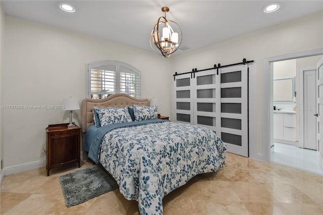 bedroom with an inviting chandelier and a barn door