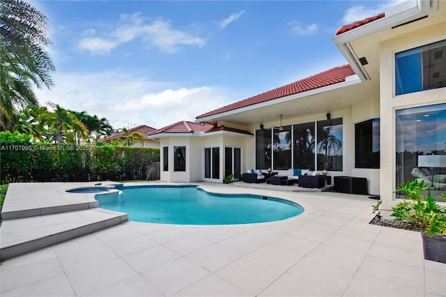 view of swimming pool with an in ground hot tub, an outdoor hangout area, and a patio