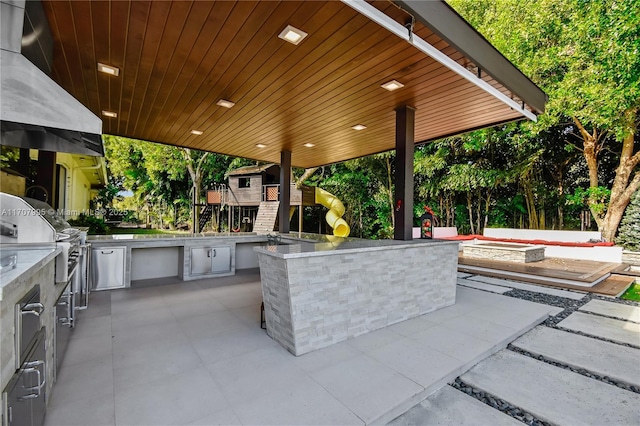 view of patio with area for grilling and grilling area