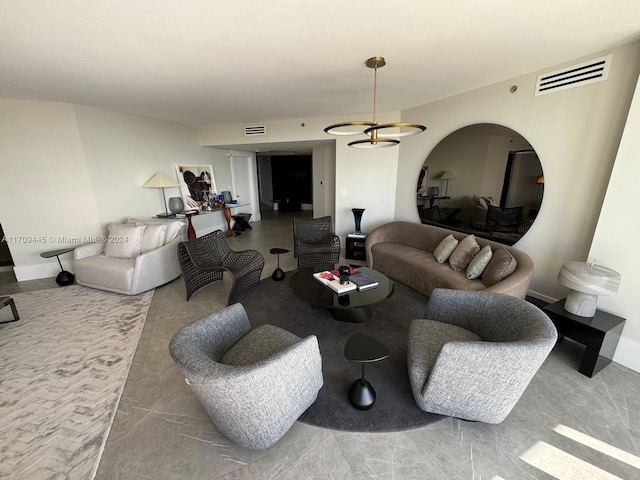 living room featuring an inviting chandelier