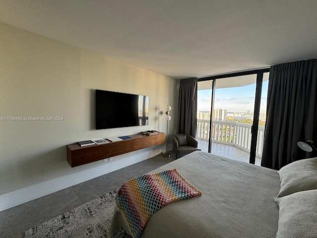 bedroom featuring access to outside and expansive windows