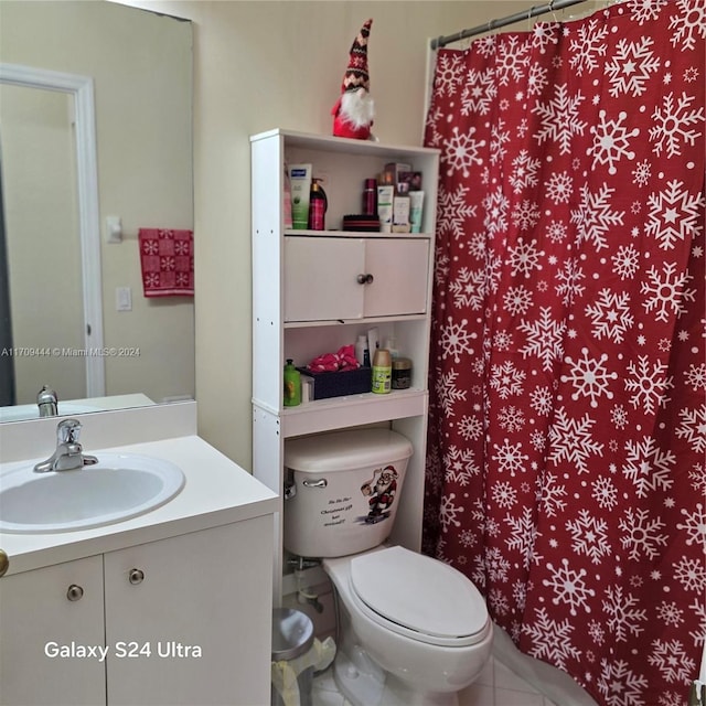 bathroom with a shower with shower curtain, vanity, and toilet