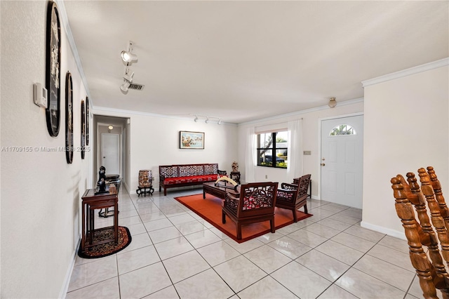 living room with rail lighting, light tile patterned floors, and ornamental molding