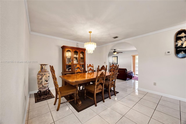 dining room featuring light tile patterned floors, ceiling fan with notable chandelier, and ornamental molding