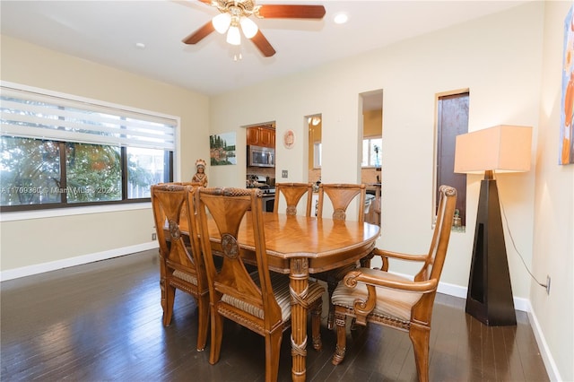 dining area with ceiling fan and dark wood-type flooring