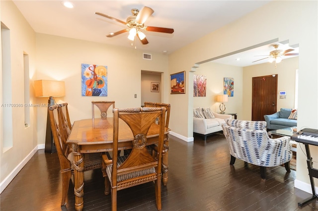 dining area with dark hardwood / wood-style floors and ceiling fan