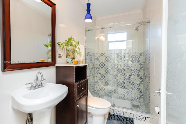 bathroom featuring toilet, an enclosed shower, ornamental molding, and sink