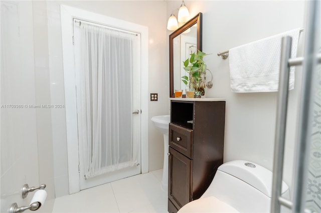 bathroom featuring tile patterned floors and toilet