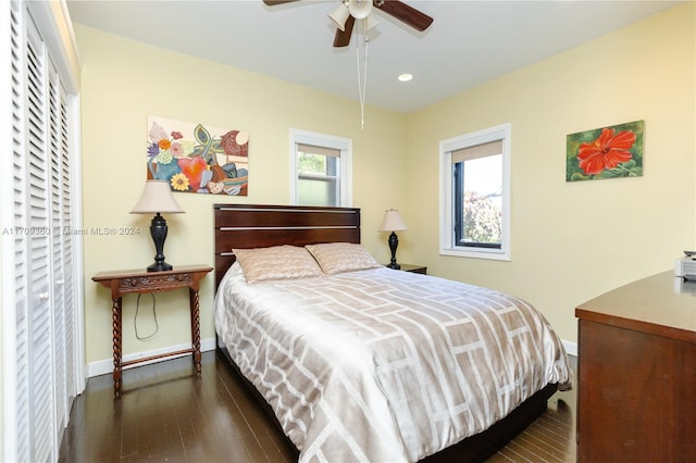 bedroom with ceiling fan and dark wood-type flooring