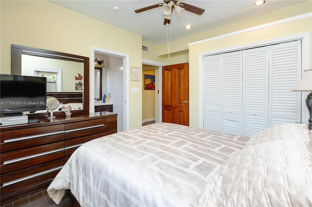 bedroom featuring hardwood / wood-style floors, a closet, and ceiling fan