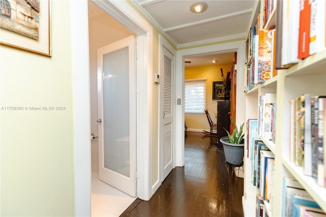 hallway featuring dark hardwood / wood-style flooring and ornamental molding