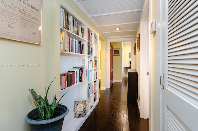 hallway with dark wood-type flooring