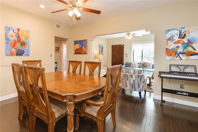 dining room featuring dark hardwood / wood-style flooring and ceiling fan