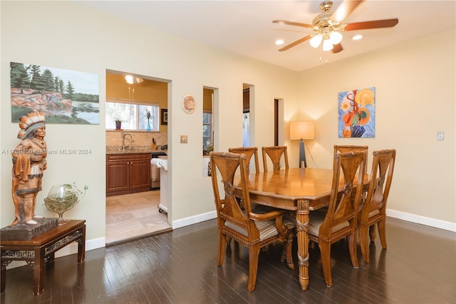 dining area with ceiling fan, hardwood / wood-style floors, and sink