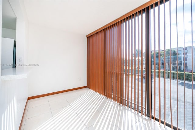 tiled empty room with expansive windows