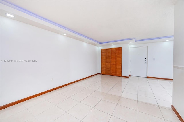 unfurnished room with light tile patterned flooring