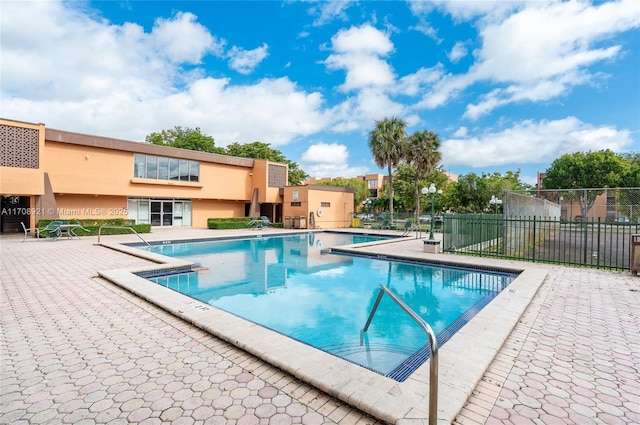 view of pool featuring a patio