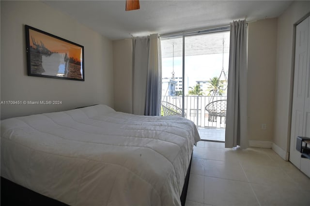 bedroom featuring light tile patterned floors, access to outside, and ceiling fan