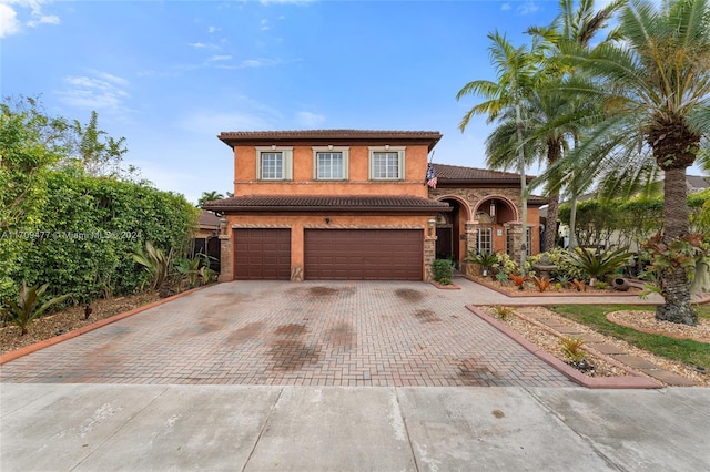 mediterranean / spanish-style home featuring a garage