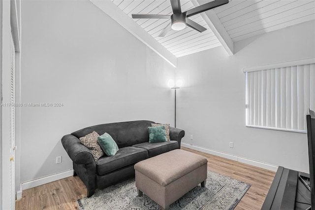 living room featuring ceiling fan, wooden ceiling, lofted ceiling with beams, and light hardwood / wood-style floors