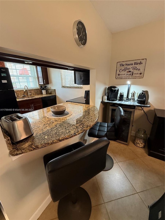 kitchen featuring sink and light tile patterned flooring