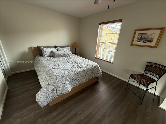 bedroom featuring ceiling fan and dark hardwood / wood-style flooring