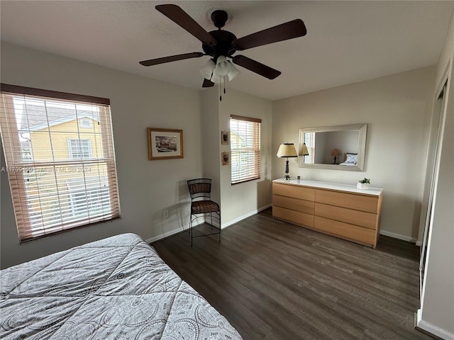 bedroom featuring ceiling fan and dark wood-type flooring