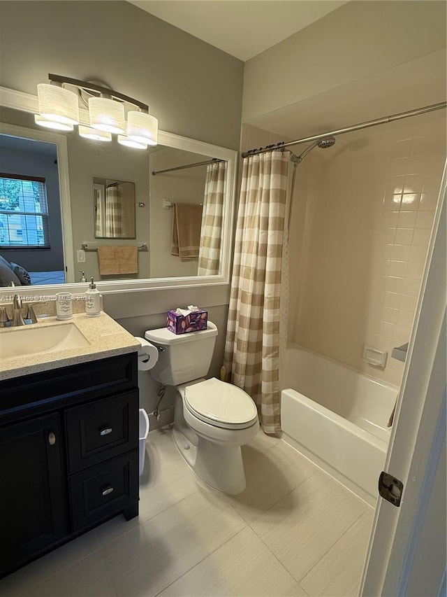 full bathroom featuring toilet, tile patterned floors, vanity, and shower / tub combo with curtain