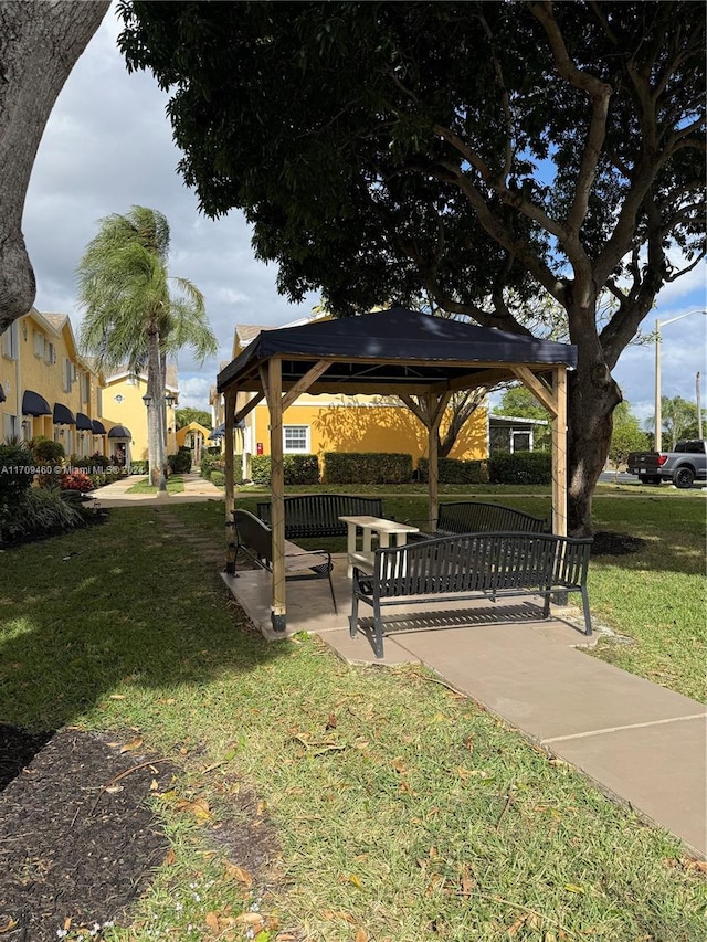 view of property's community featuring a gazebo and a lawn