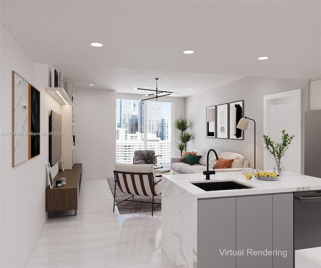 kitchen with a center island with sink, open floor plan, light stone countertops, a sink, and recessed lighting