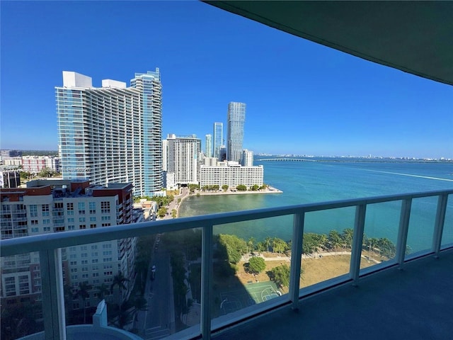 balcony featuring a water view