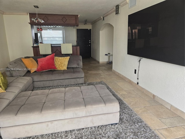 living room with ornamental molding