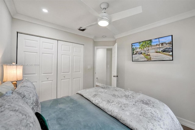 bedroom with a closet, ceiling fan, and ornamental molding