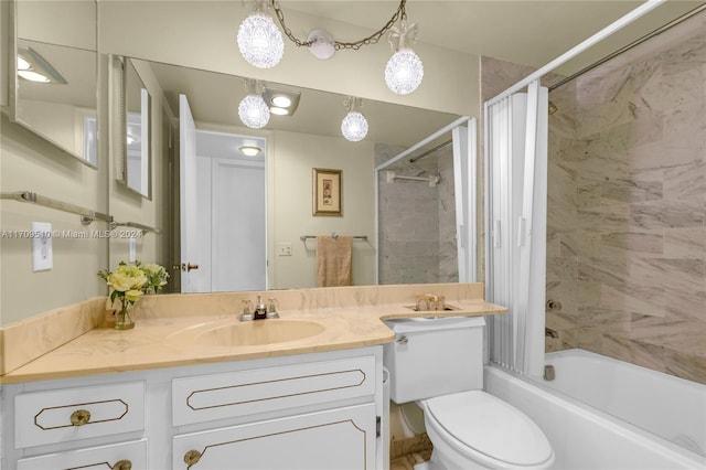 full bathroom featuring vanity, toilet, and tiled shower / bath