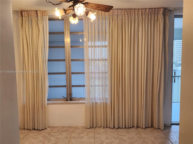 details featuring a textured ceiling and ceiling fan