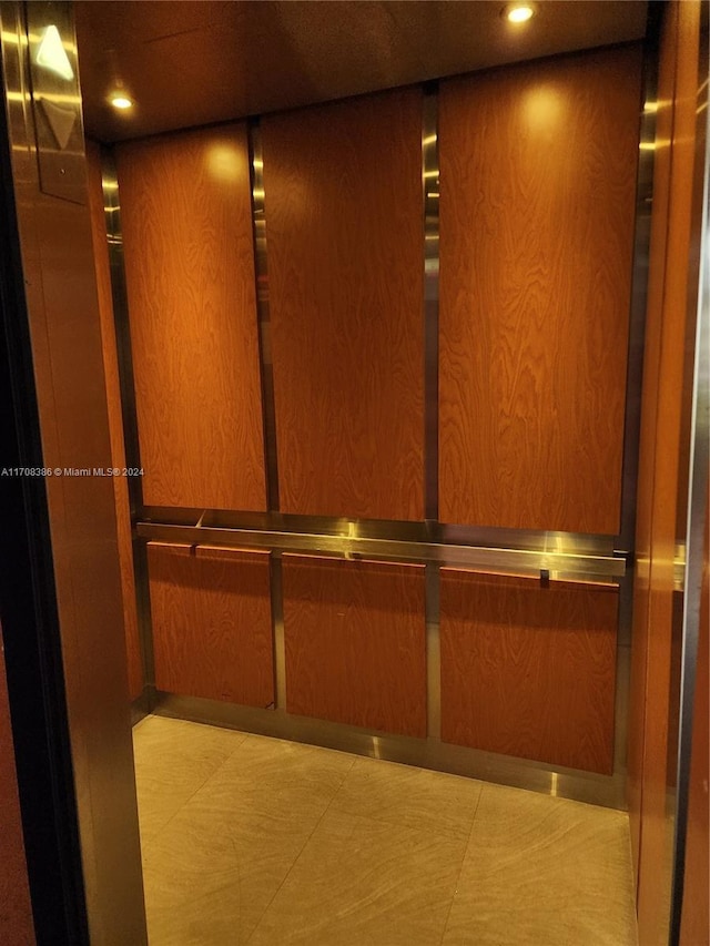 interior details with elevator and wood walls