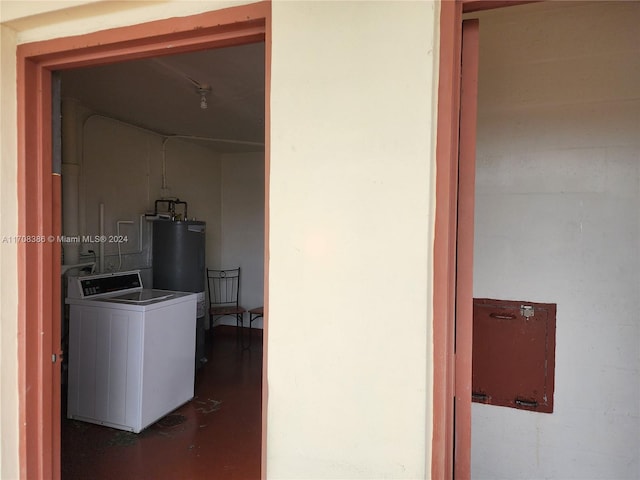 interior space with washer / clothes dryer and water heater