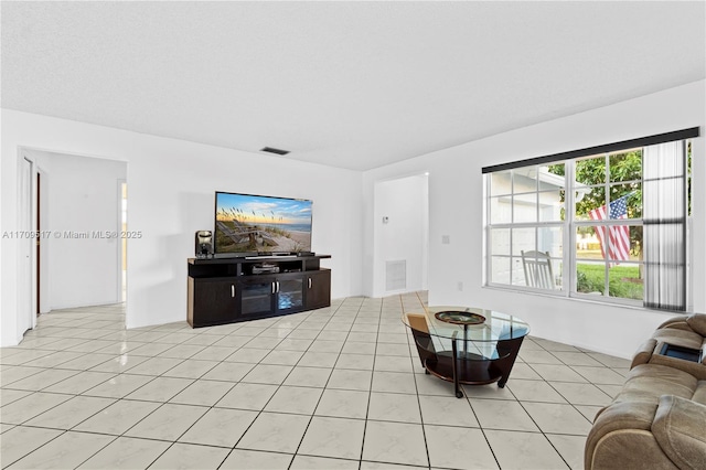 living room featuring light tile patterned flooring