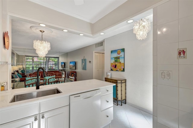 kitchen featuring white dishwasher, sink, light tile patterned floors, white cabinetry, and a chandelier