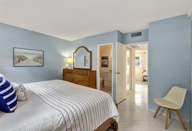 tiled bedroom with ensuite bath