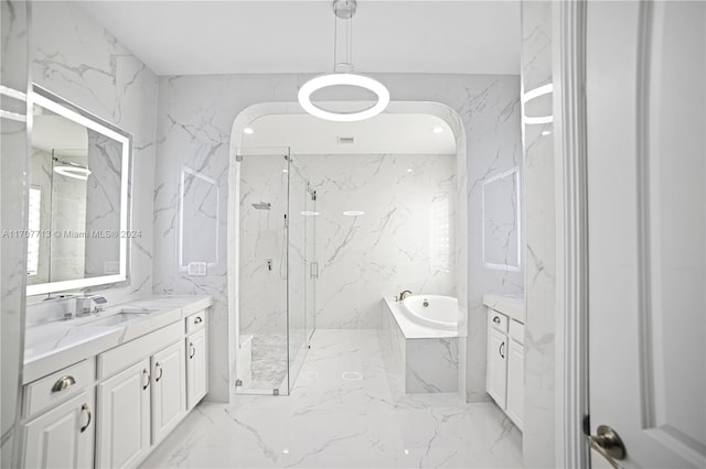 bathroom with shower with separate bathtub and vanity