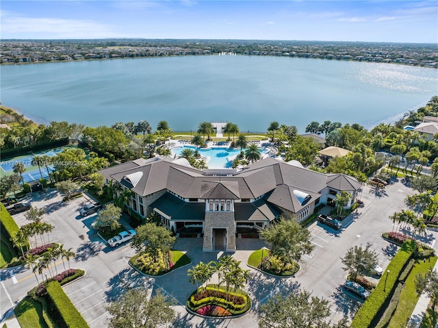 birds eye view of property with a water view