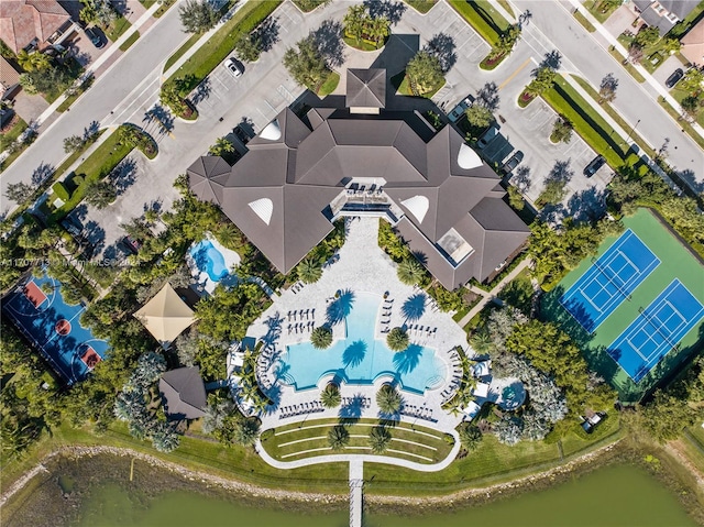 birds eye view of property with a water view