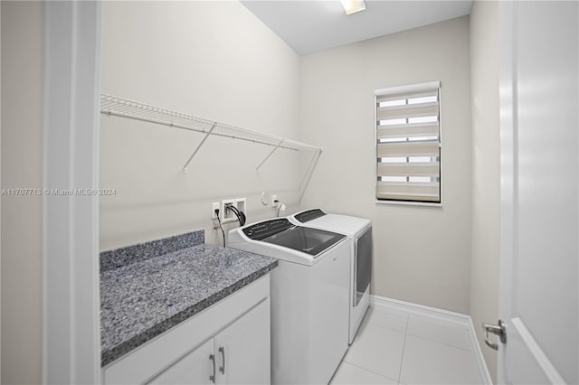 washroom featuring light tile patterned flooring and independent washer and dryer