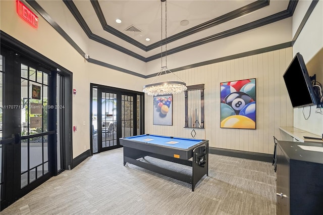 rec room featuring ornamental molding, light colored carpet, and a healthy amount of sunlight